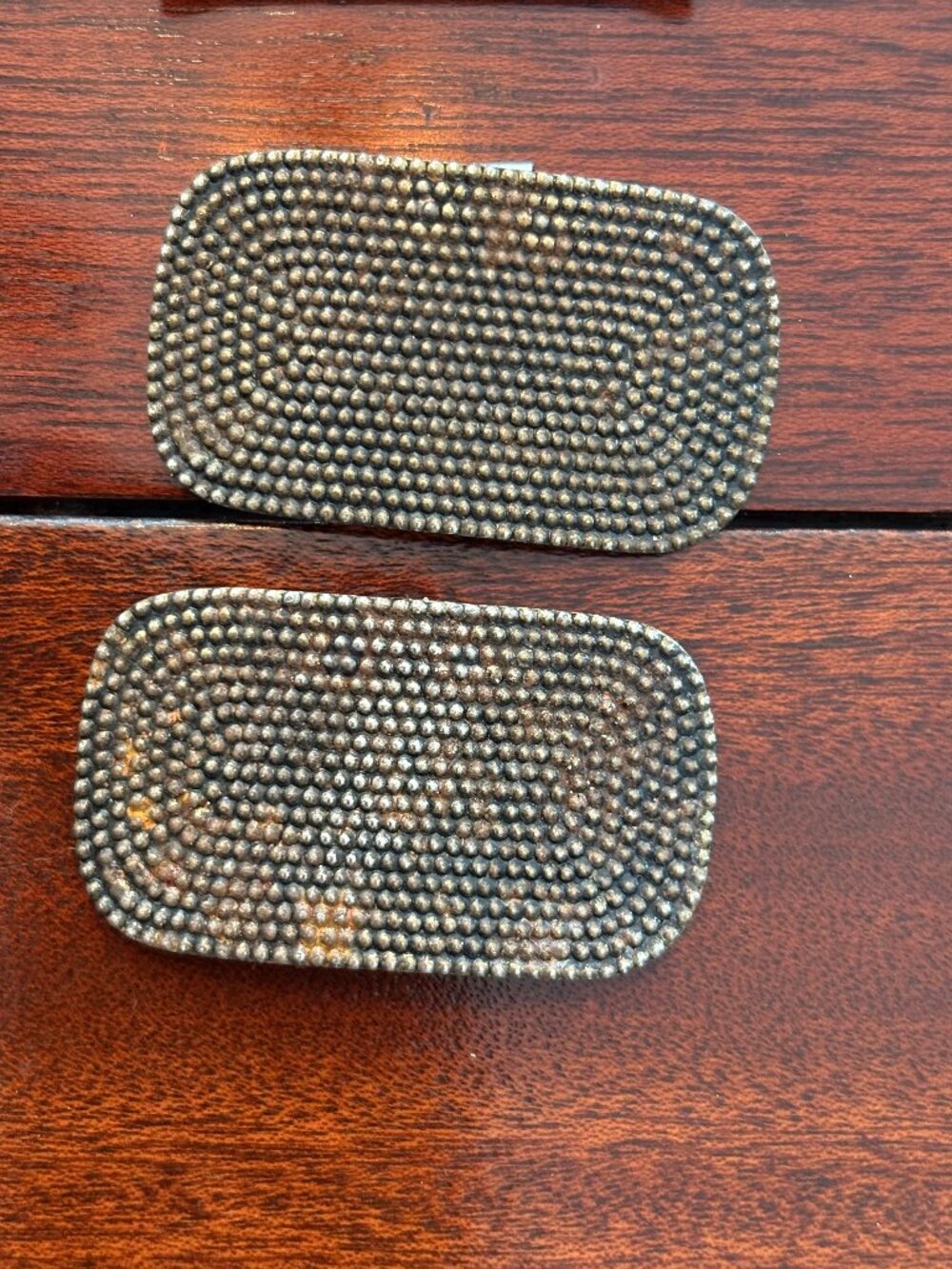 Pair of sterling silver charms with a pave-like textured surface shoe buckles